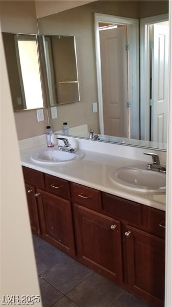 7414 Page Ranch Court Las Vegas, NV 89131 - Photo 28 of 36 Full bath featuring double vanity and dark tile patterned floors