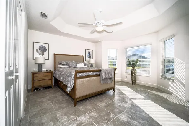 a bathroom with a sink a toilet a mirror and shower