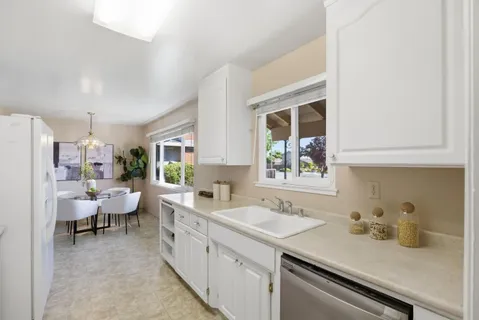 a spacious bathroom with a sink and a window