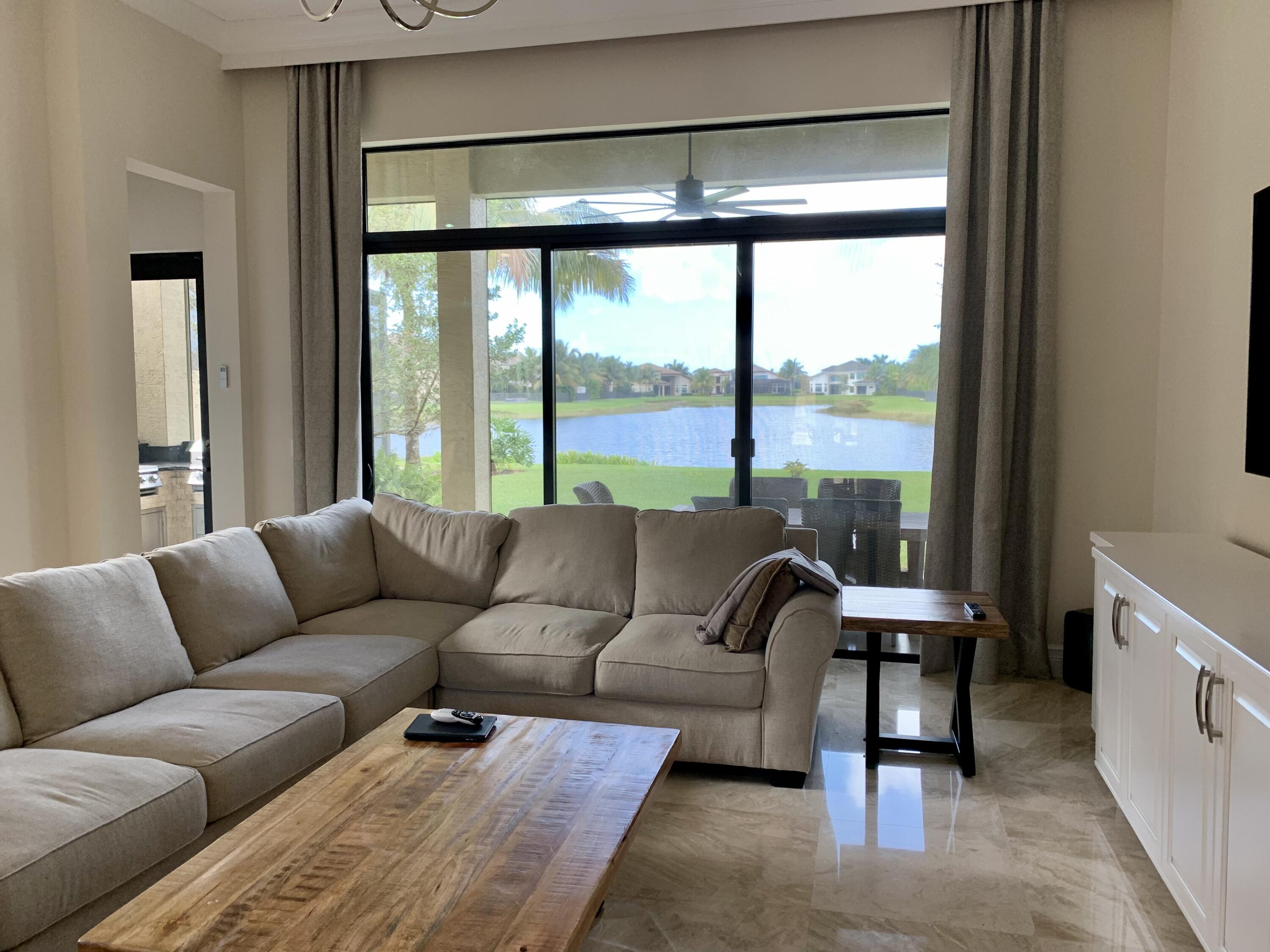 16831 Pavilion Way Delray Beach, FL 33446 - Photo 12 of 26 a living room with furniture and a large window