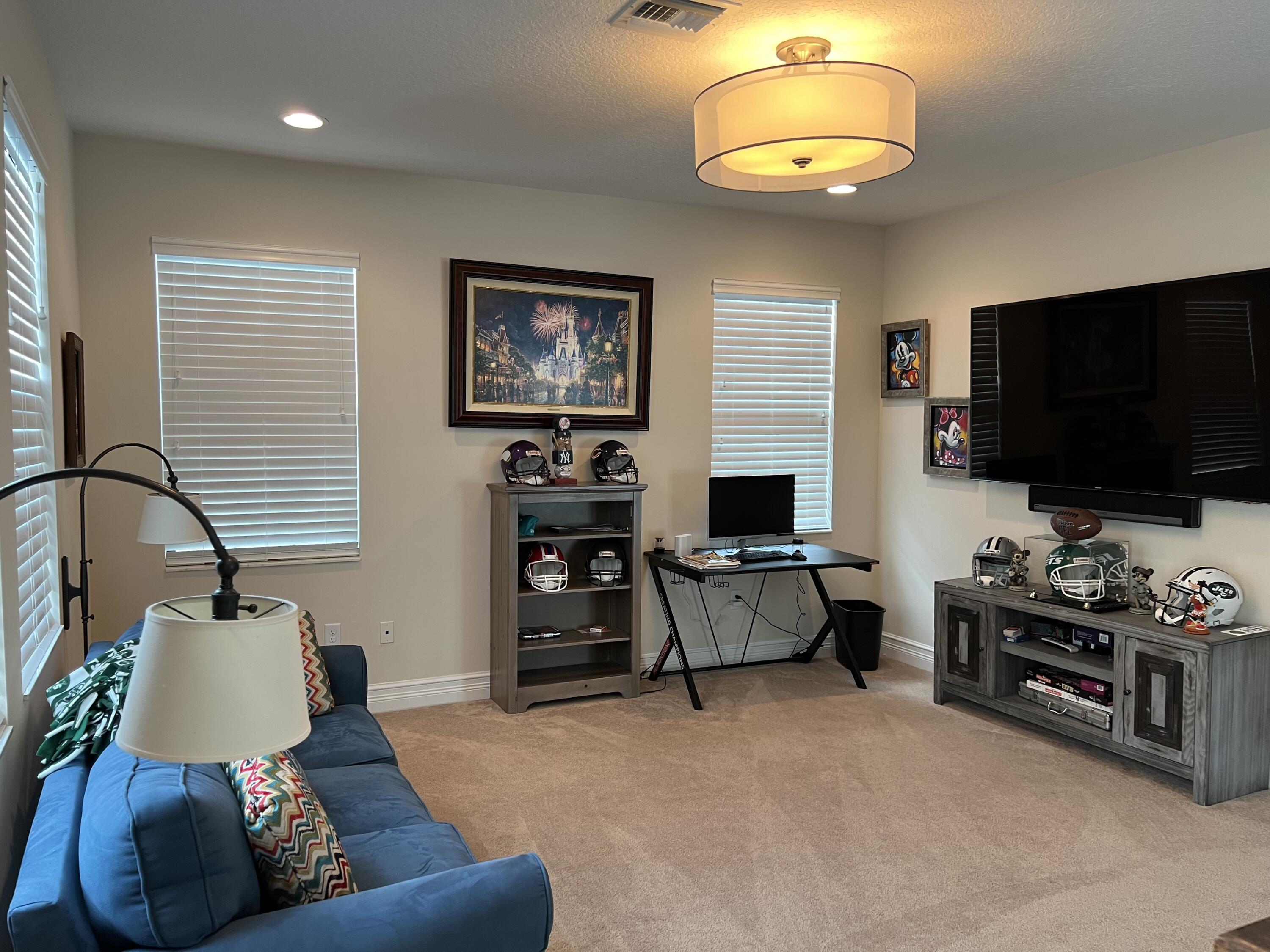 16831 Pavilion Way Delray Beach, FL 33446 - Photo 15 of 26 a living room with furniture and a flat screen tv