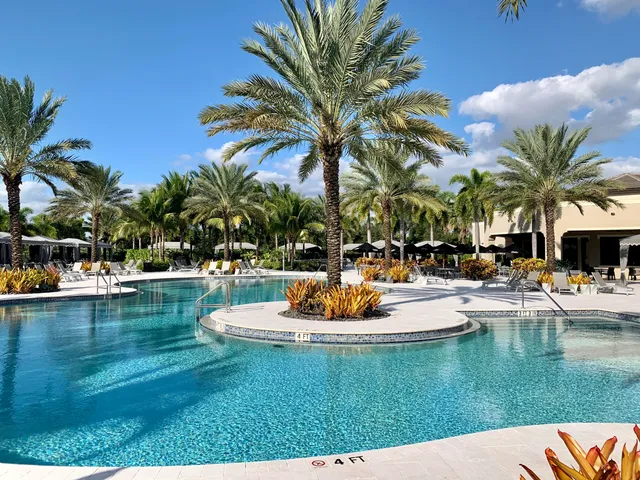 a swimming pool with outdoor seating and yard