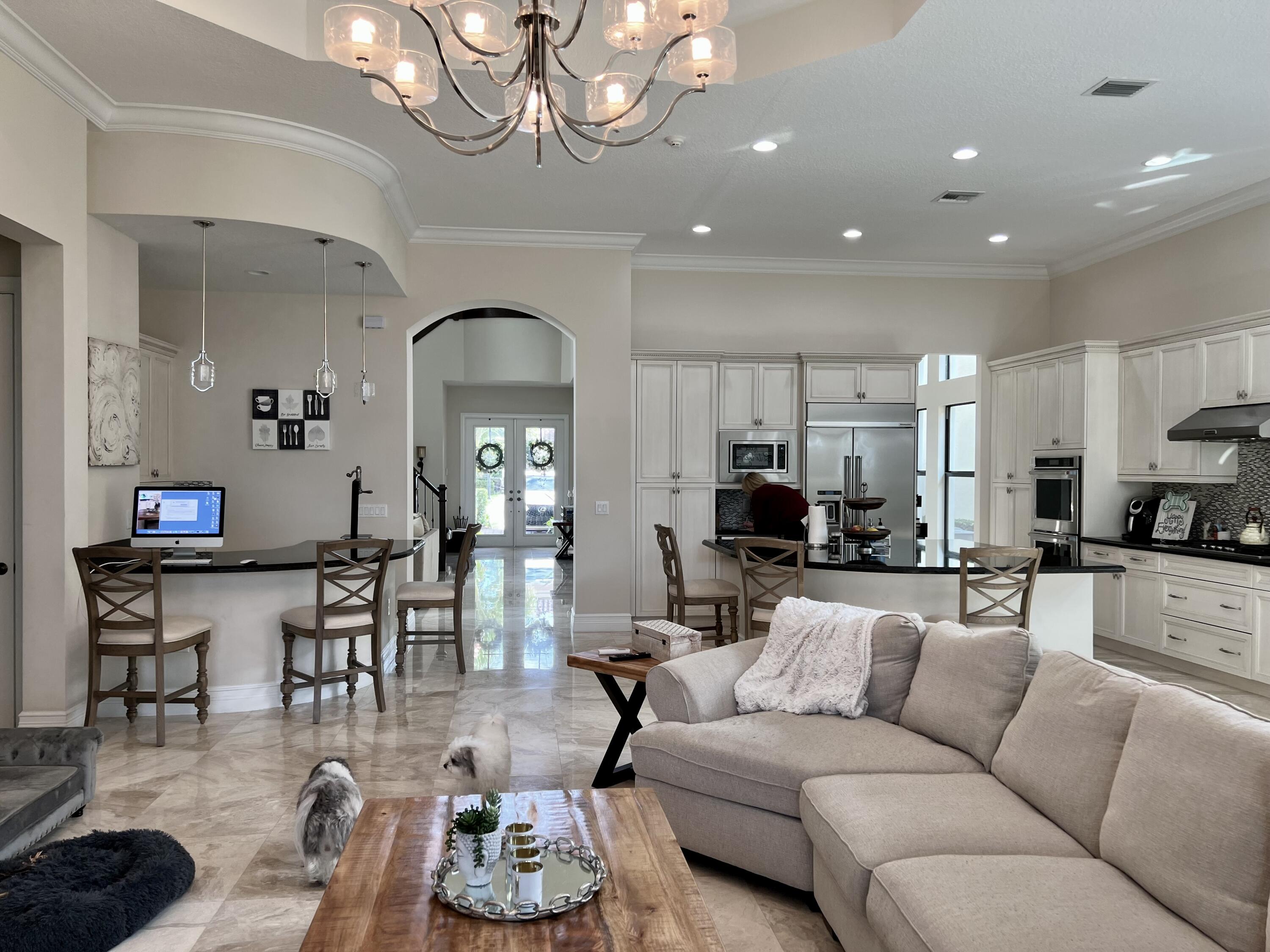 16831 Pavilion Way Delray Beach, FL 33446 - Photo 10 of 26 a living room with furniture and a chandelier