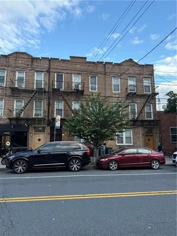 a cars parked in front of a buildings