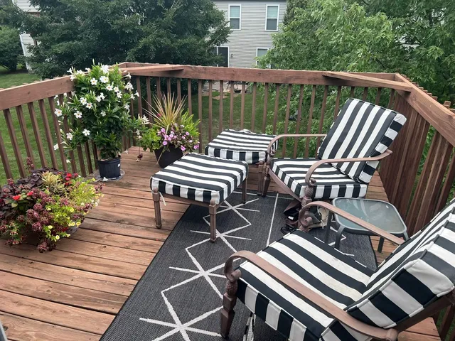 a view of a patio with two chairs and a table