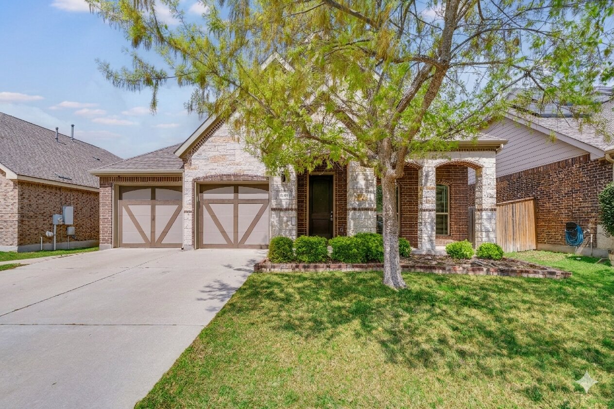 22005 Rhiannon Lane Pflugerville, TX 78660 - Photo 1 of 21 a front view of a house with garden
