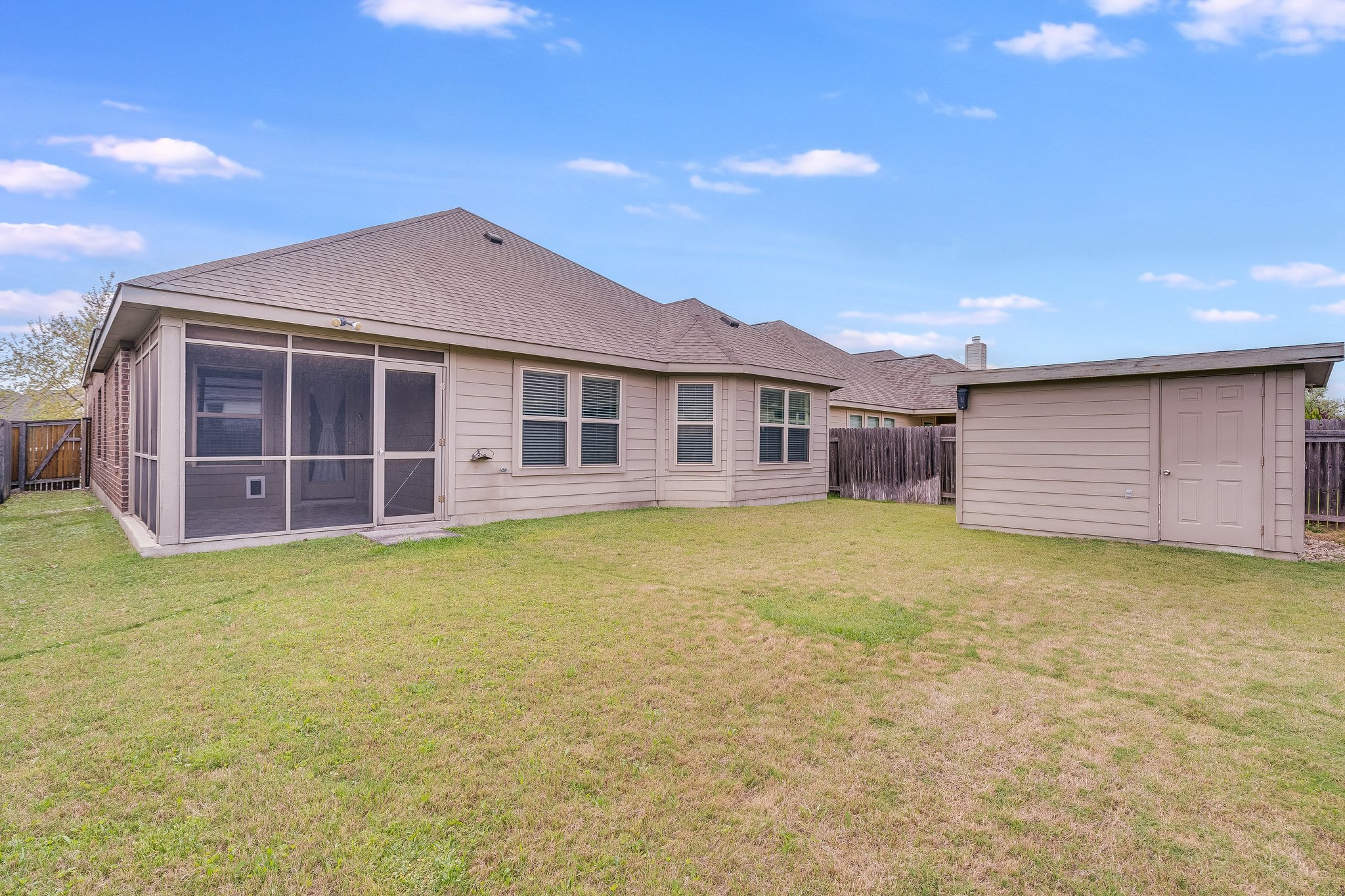 22005 Rhiannon Lane Pflugerville, TX 78660 - Photo 15 of 21 a front view of a house with a garden