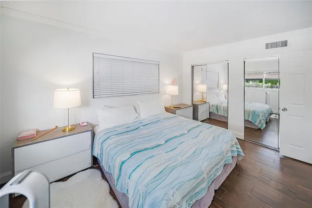 a bed room with a bed and a lamp