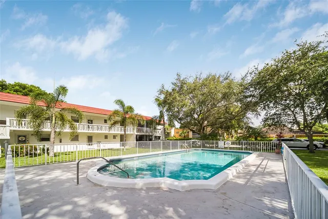 a view of a swimming pool with a patio