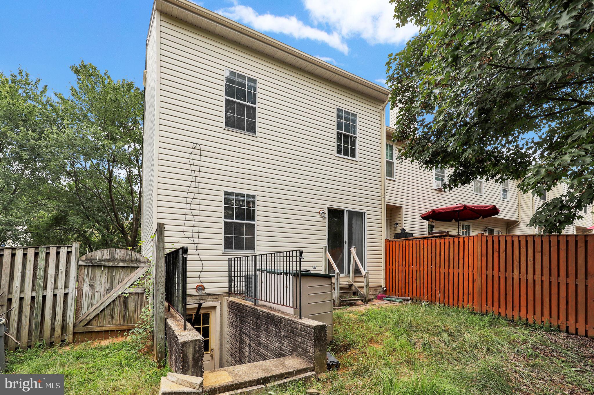 9216 Howland Road Laurel, MD 20723 - Photo 23 of 28 a view of backyard with deck and wooden fence