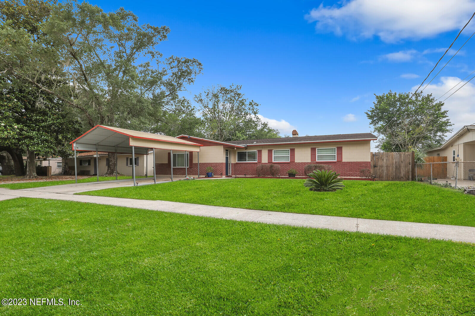 5814 Rover Drive Jacksonville, FL 32244 - Photo 1 of 30 a front view of a house with a garden
