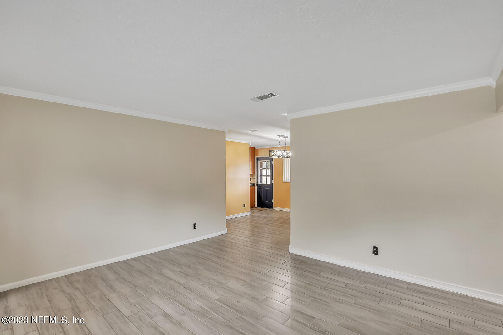 5814 Rover Drive Jacksonville, FL 32244 - Photo 11 of 30 a view of an empty room with wooden floor