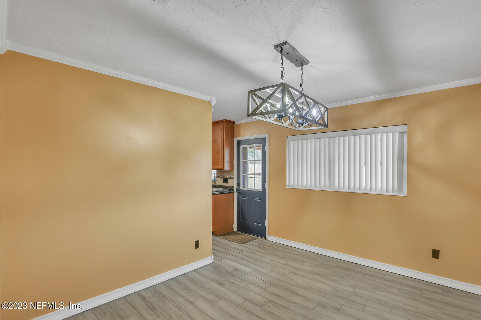 5814 Rover Drive Jacksonville, FL 32244 - Photo 14 of 30 a view of an empty room with wooden floor