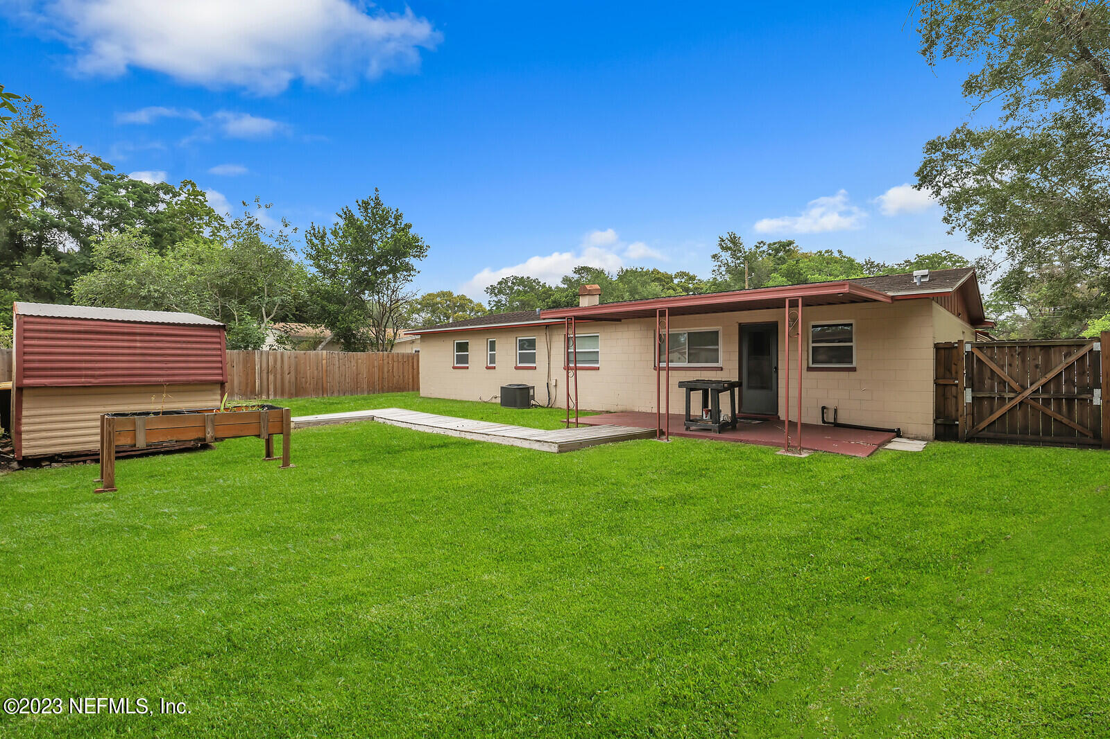 5814 Rover Drive Jacksonville, FL 32244 - Photo 28 of 30 a view of a house with a backyard