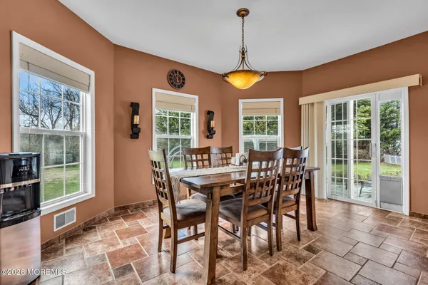 a view of house with garden space and trees