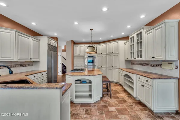 a view of a patio with couches chairs and a yard