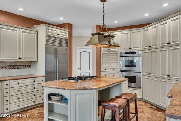 a view of a patio with a table and chairs