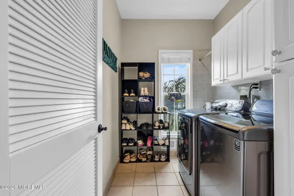 an aerial view of a residential houses with outdoor space