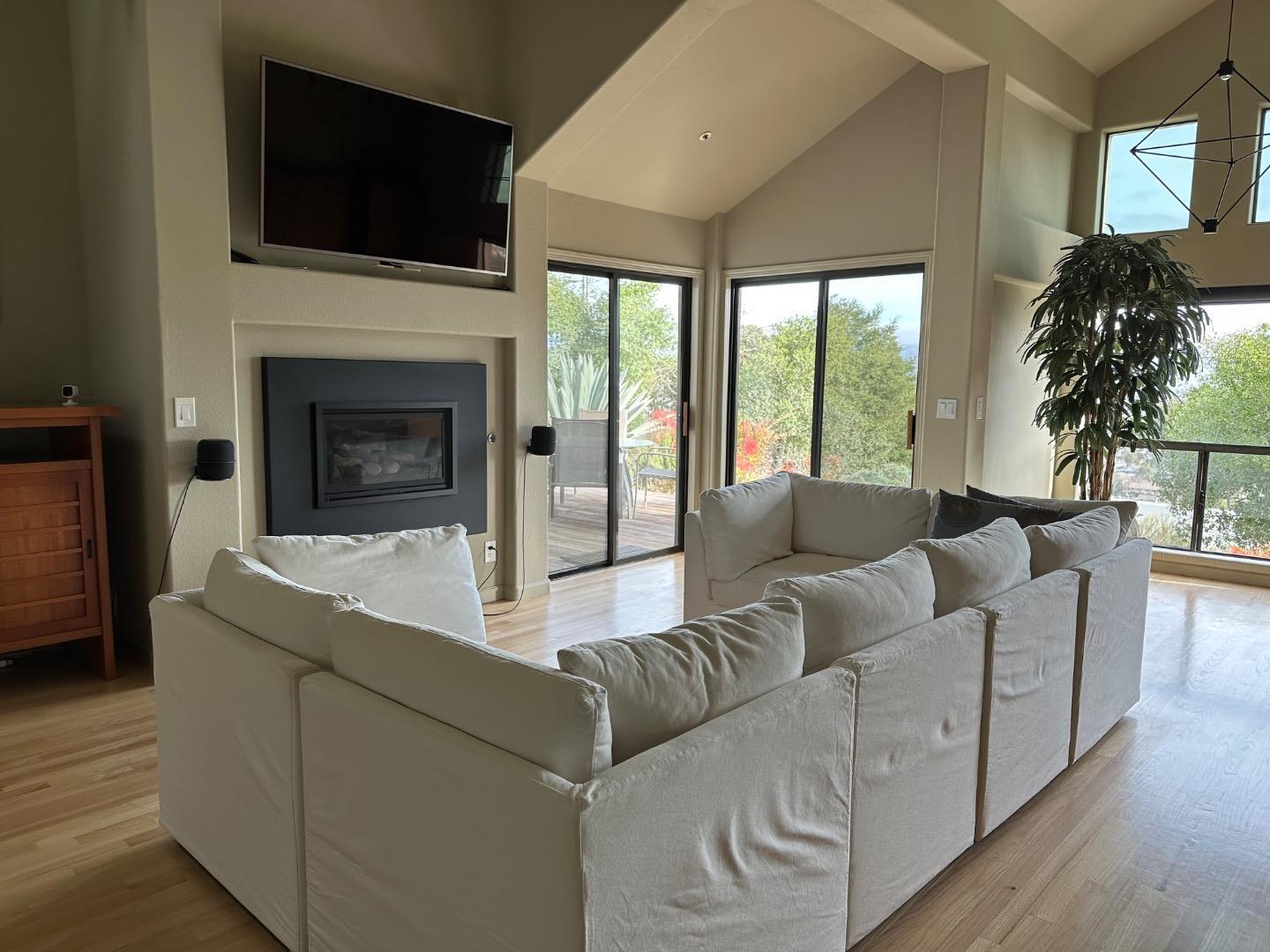 8255 Rancho Real Gilroy, CA 95020 - Photo 11 of 21 a living room with furniture fireplace and flat screen tv