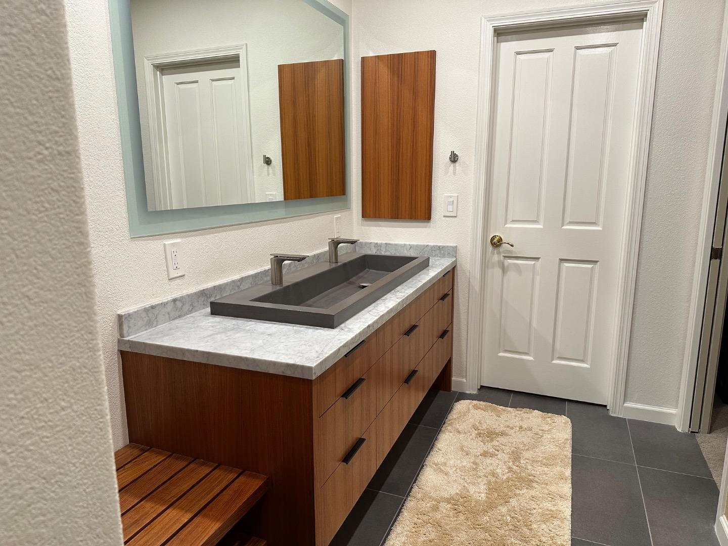 8255 Rancho Real Gilroy, CA 95020 - Photo 14 of 21 a bathroom with a sink and a mirror