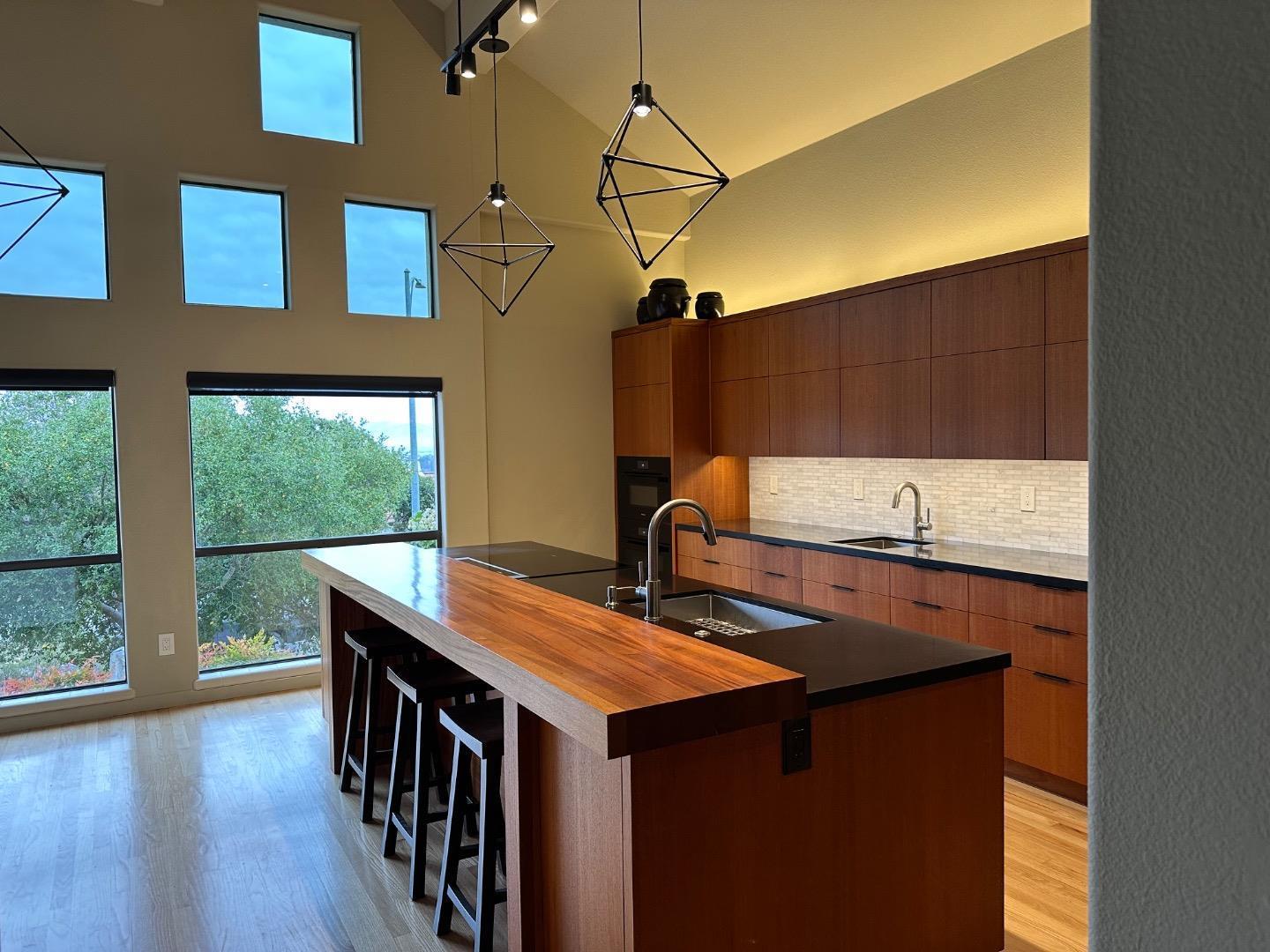 8255 Rancho Real Gilroy, CA 95020 - Photo 6 of 21 a kitchen with a sink a window and cabinets