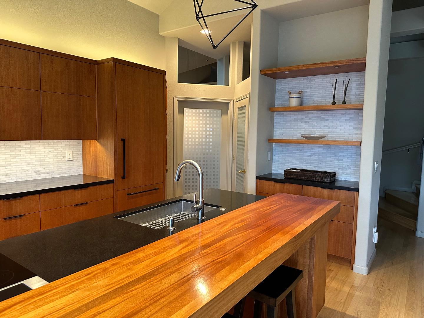 8255 Rancho Real Gilroy, CA 95020 - Photo 7 of 21 a room with balcony door and wooden floor