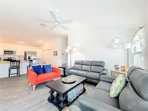 a living room with furniture and a rug