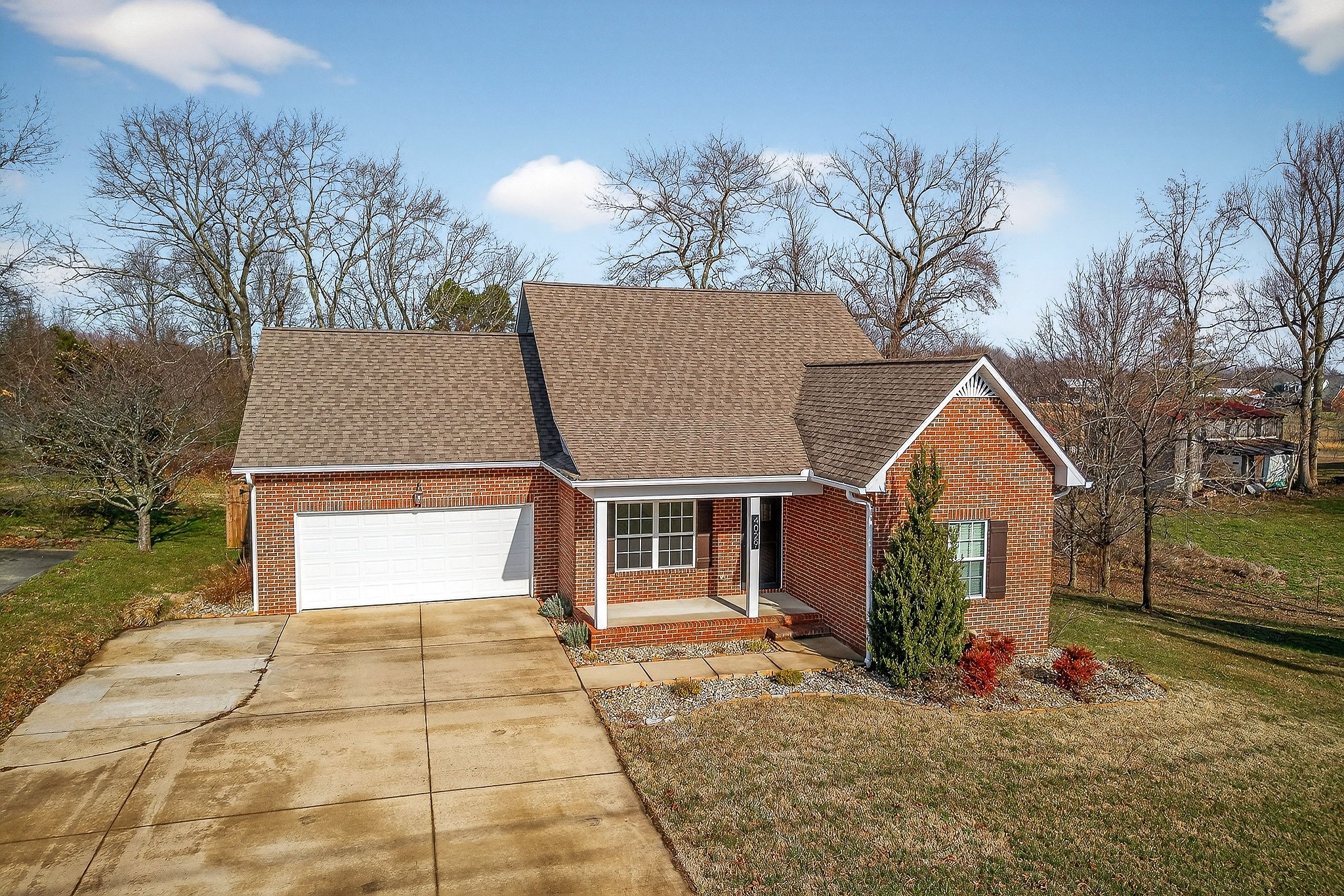 4029 Buffalo Valley Road Cookeville, TN 38501 - Photo 2 of 36 a view of a house with a yard and potted plants
