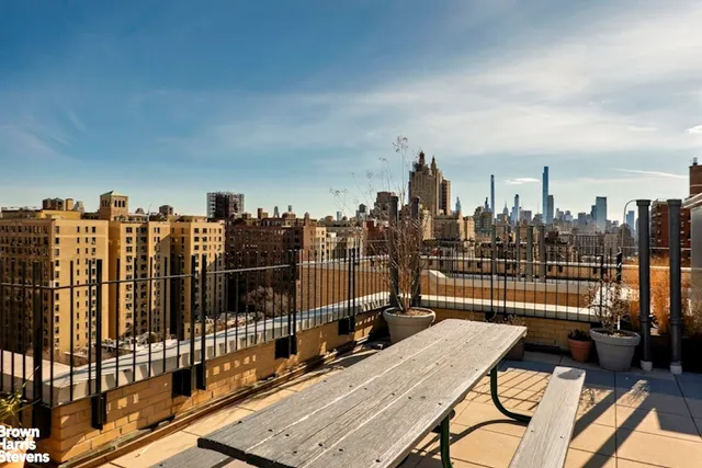 a view of a balcony with an outdoor seating