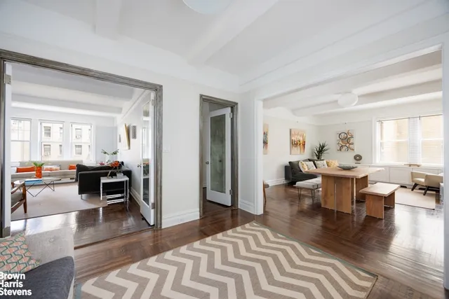 a living room with furniture or couch and a wooden floor