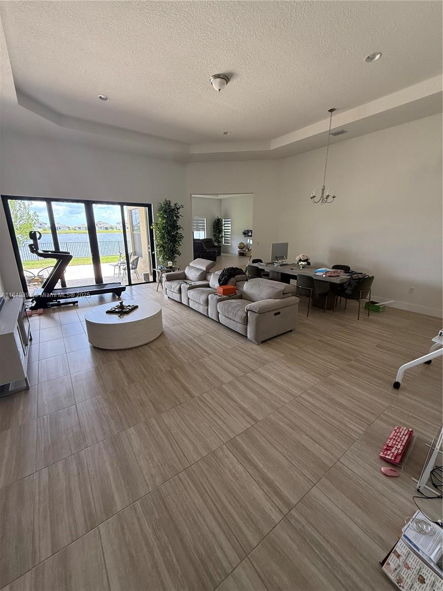 Maple Ridge Ave Maria, FL 34142 - Photo 2 of 5 a living room with furniture and a wooden floor