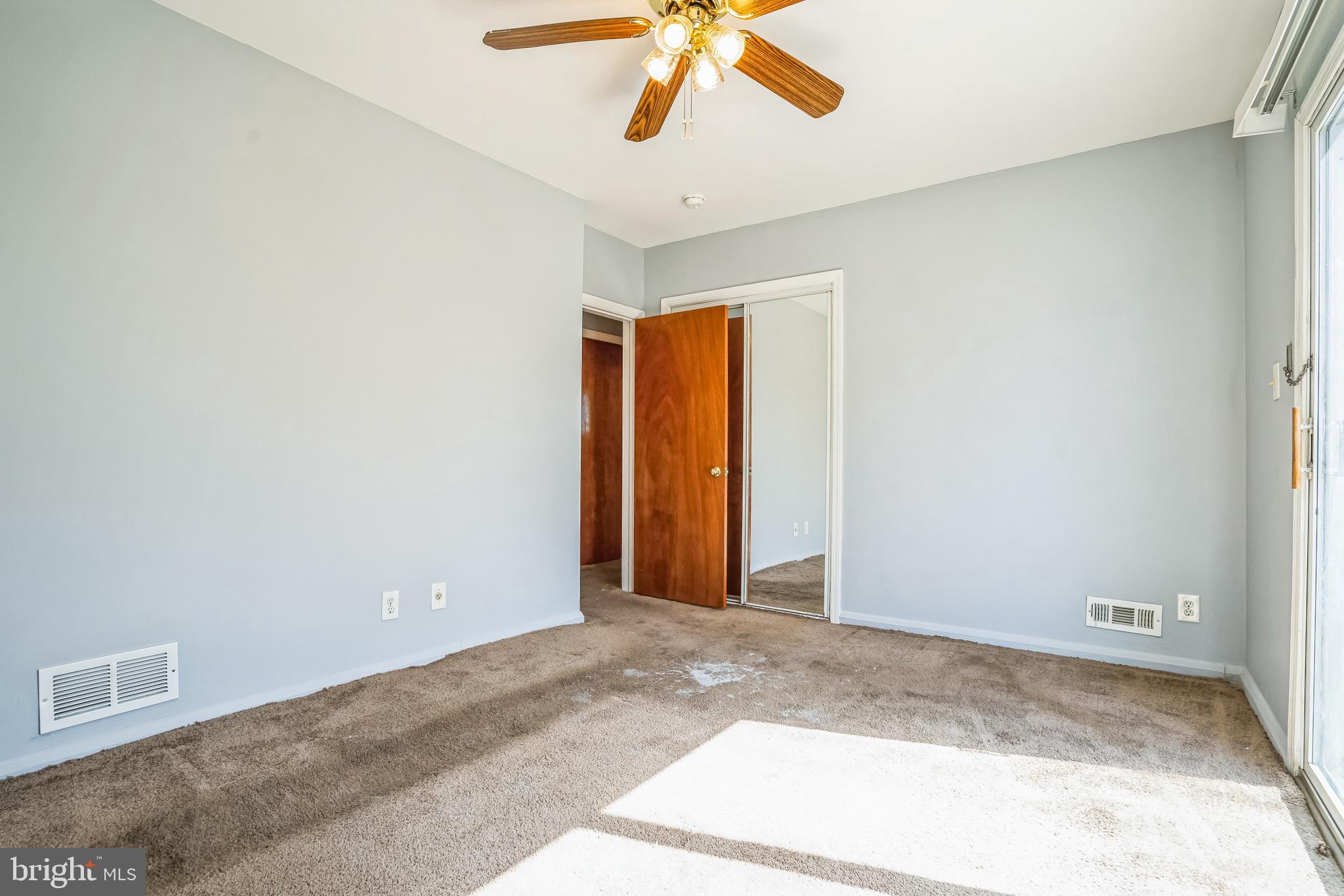 7911 35th Street Rosedale, MD 21237 - Photo 15 of 30 a view of a room with a ceiling fan and window