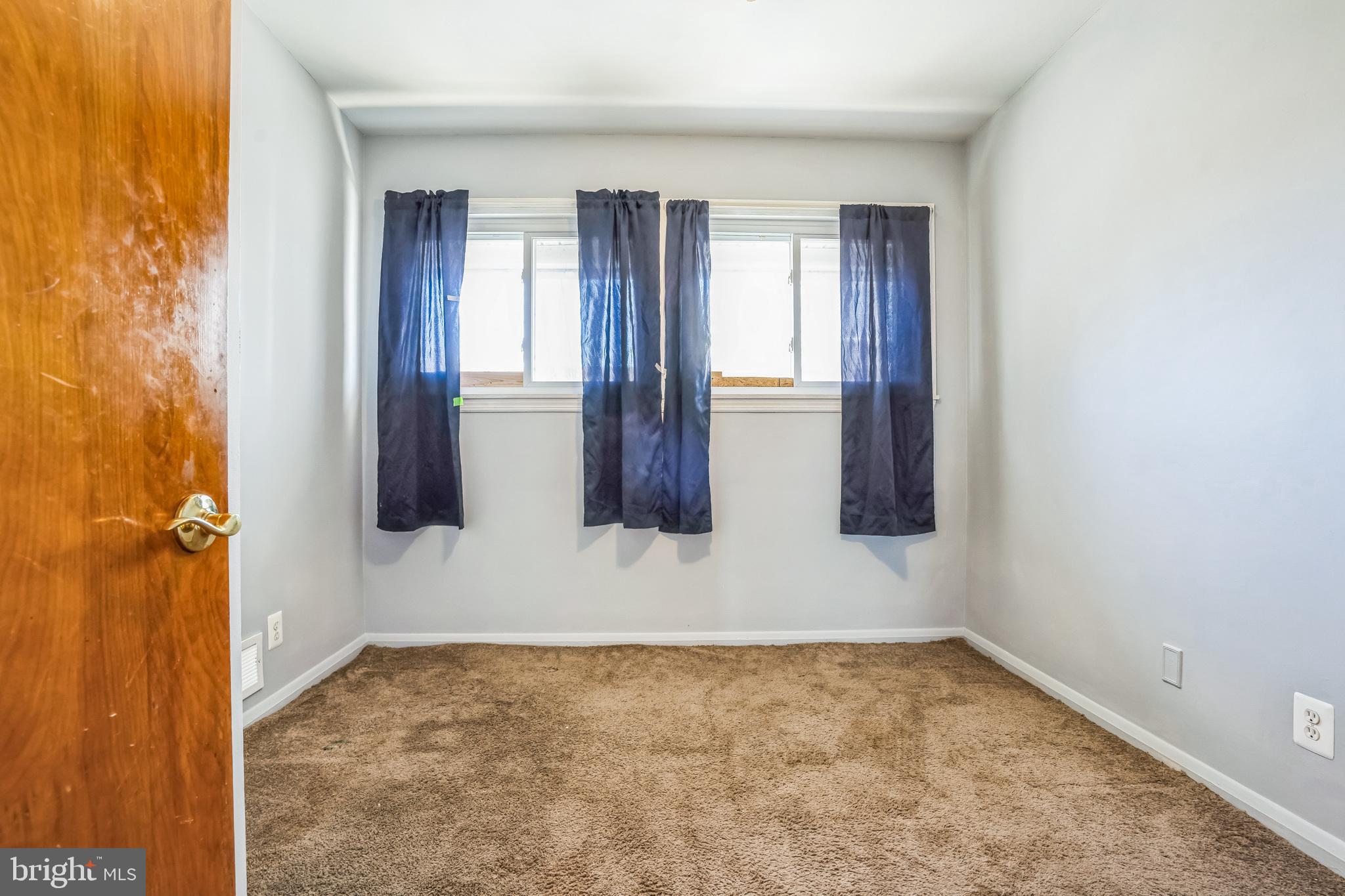 7911 35th Street Rosedale, MD 21237 - Photo 19 of 30 a view of an empty room with windows