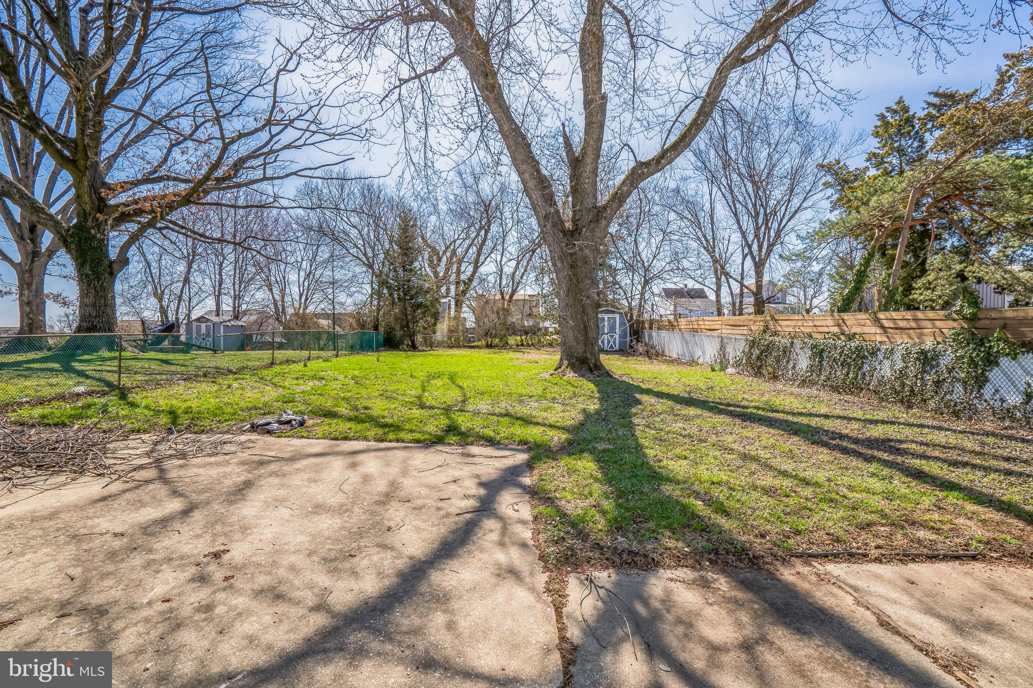 7911 35th Street Rosedale, MD 21237 - Photo 25 of 30 a view of a yard with a house and large trees