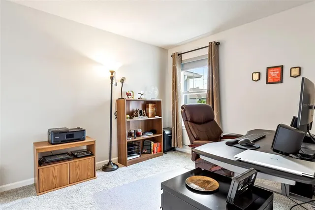 a room with furniture and gym equipment