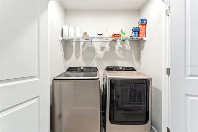 a utility room with dryer and washer