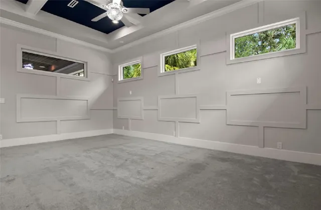 a living room with furniture and a view of the lobby