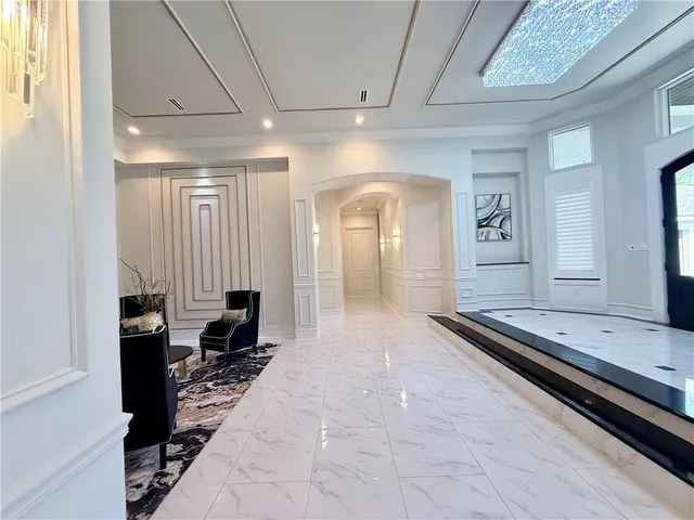 a lobby with furniture and wooden floor