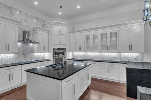 a bathroom with a sink a large mirror and a shower