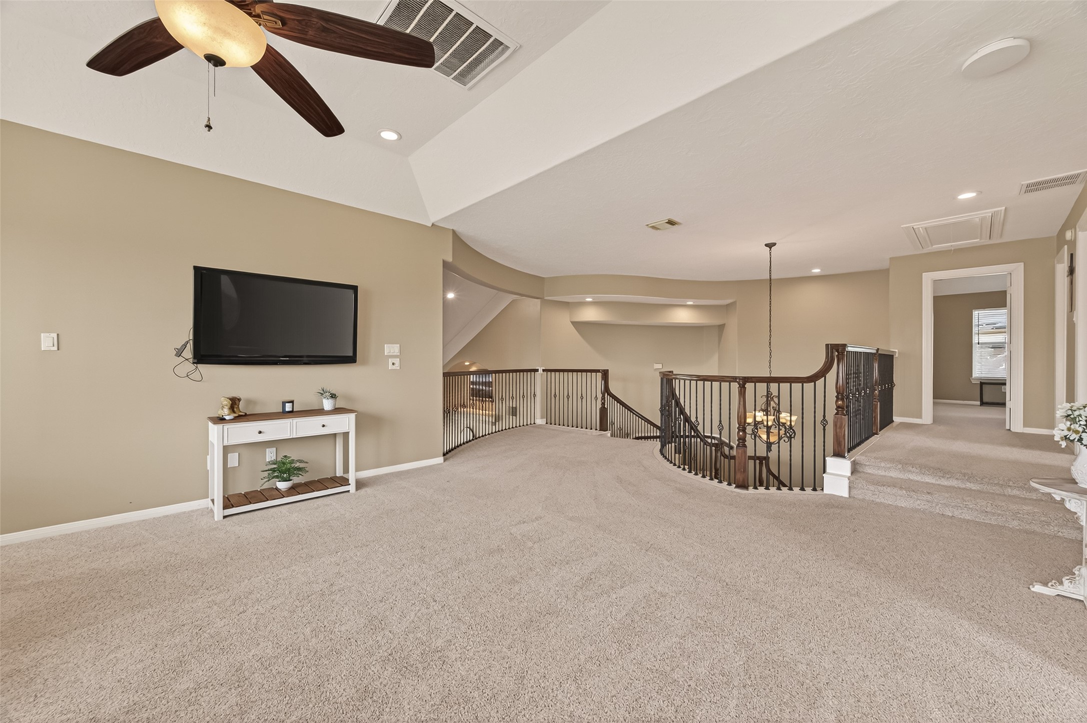 2319 Braer Ridge Drive Katy, TX 77494 - Photo 30 of 50 an empty room with furniture and a flat screen tv