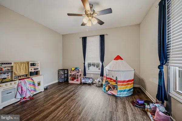 a play room with toys and a flat screen tv