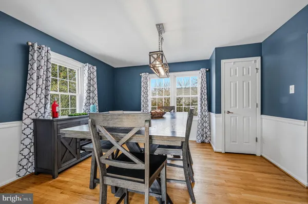 a view of a dining room with furniture window and wooden floor