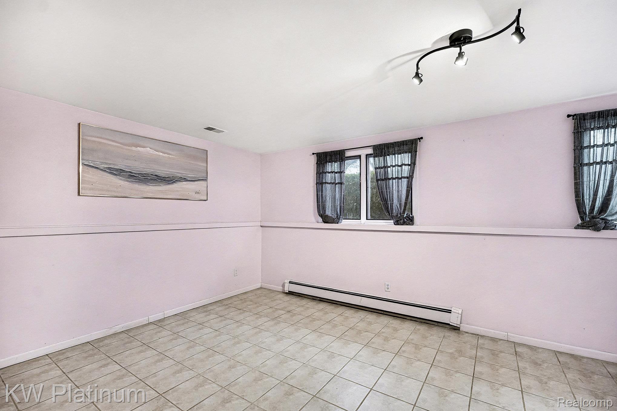 185 Michelson Road Rochester, MI 48307 - Photo 31 of 36 Unfurnished room featuring a baseboard heating unit and baseboards