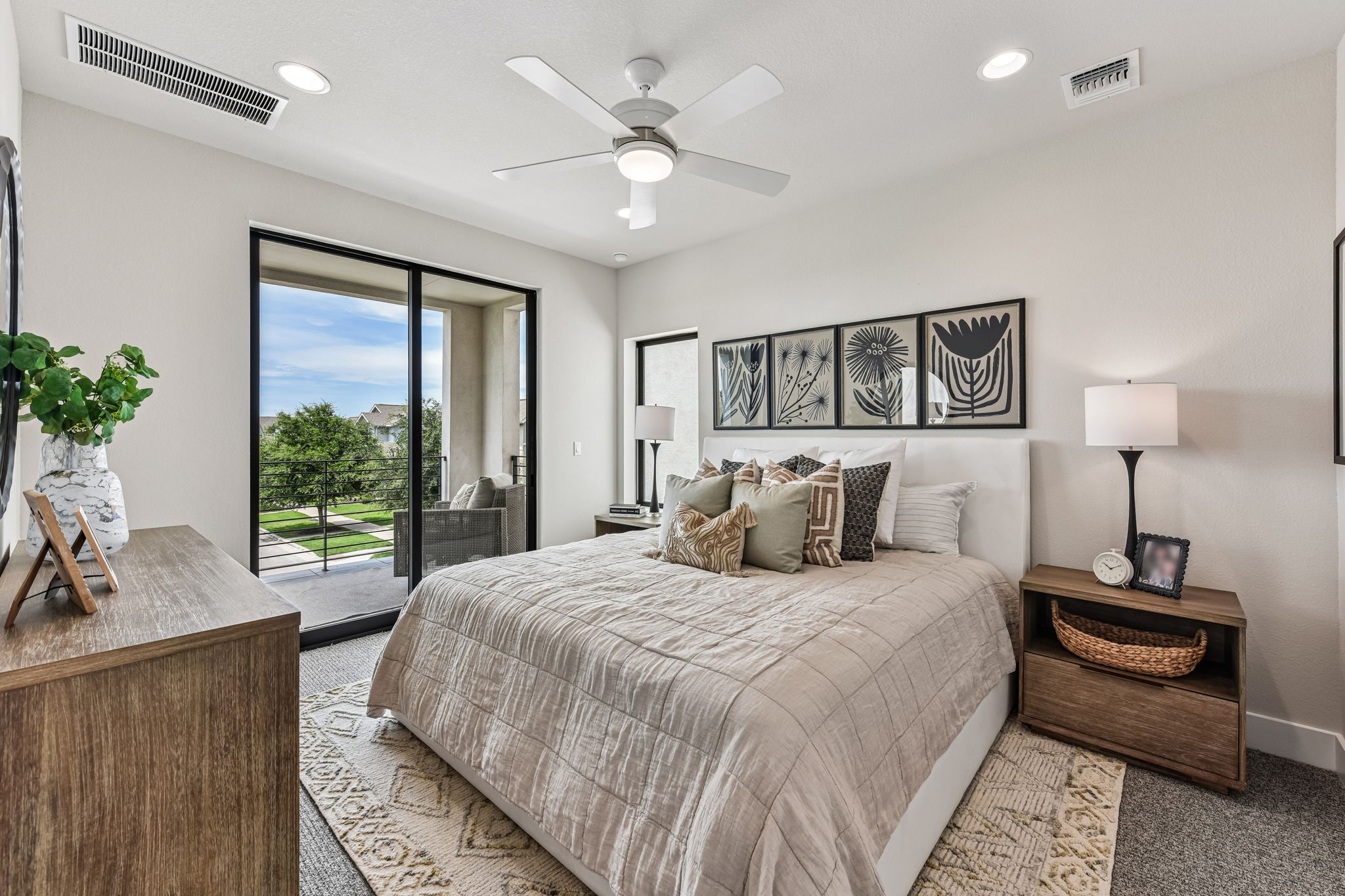 9101 Cattle Baron Path Austin, TX 78747 - Photo 20 of 40 Retreat to a comfortable bedroom featuring a private balcony and soft carpeting.