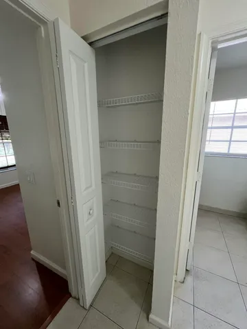 a view of a golf club with a flower garden