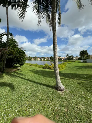 a front view of building with yard