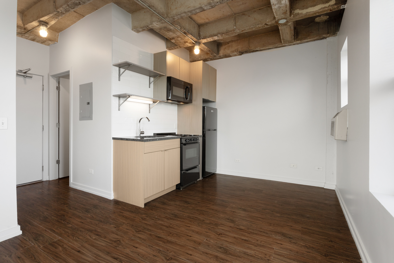 1325 West Wilson Avenue, Unit 1102 Chicago, IL 60640 - Photo 7 of 20 a kitchen with stainless steel appliances a refrigerator and a stove top oven
