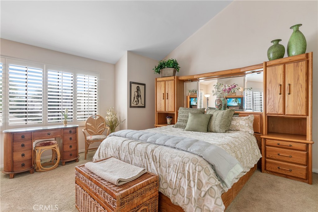 333 Genoa Street, Unit 6 Arcadia, CA 91006 - Photo 21 of 40 a bedroom with a bed a flat tv screen and dresser