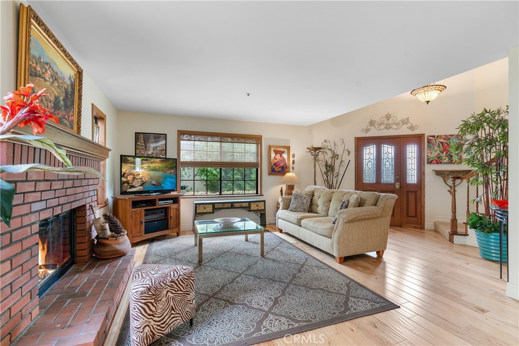 333 Genoa Street, Unit 6 Arcadia, CA 91006 - Photo 4 of 40 a living room with fireplace furniture and a flat screen tv