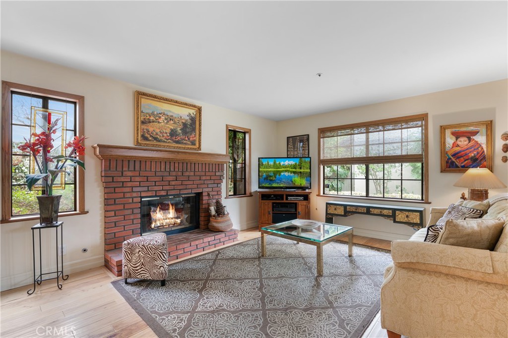 333 Genoa Street, Unit 6 Arcadia, CA 91006 - Photo 5 of 40 a living room with furniture a flat screen tv and a fireplace
